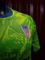 Moghreb Atlético Tetuán green and navy shirt