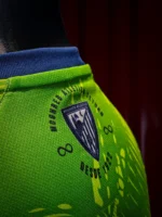 Moghreb Atlético Tetuán green and navy shirt